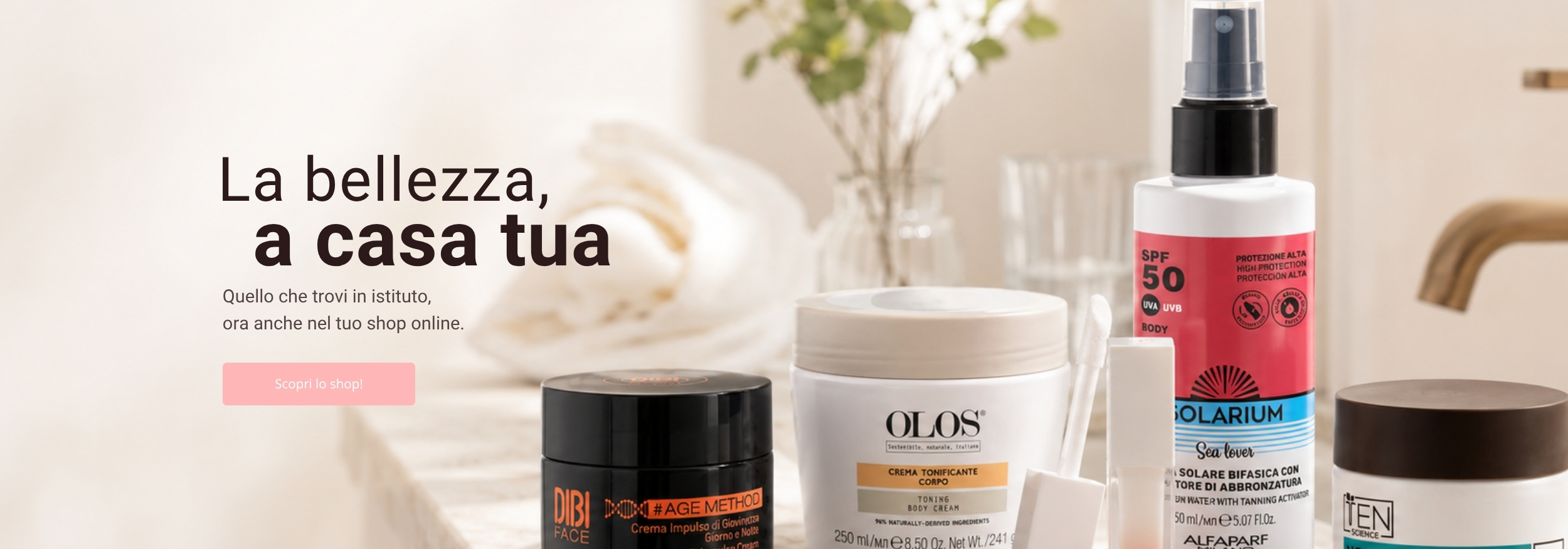 rodotti cosmetici professionali DIBI Milano, OLOS, Solarium, Essential Professional Make-Up e TEN Science disposti su un bancone, shop online Istituto di Estetica Paola